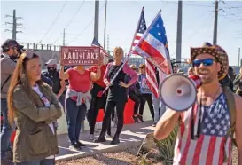  ?? (AFP) ?? Demonstrat­ors gather at a rally to protest midterm election results outside of Maricopa County Tabulation and Election Center in Phoenix, Arizona, on Saturday