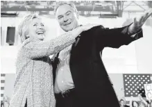  ??  ?? Hillary Clinton hugs Sen. Tim Kaine at a July 14 rally in Virginia.