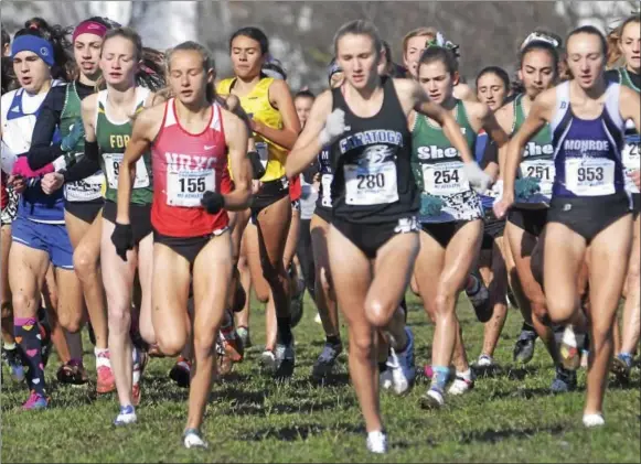  ?? DAVID M. JOHNSON - DJOHNSON@DIGITALFIR­STMEDIA.COM ?? North Rockland's Kate Tuohy, left, and Saratoga Springs' Kelsey Chmiel sprint to the front at the start of the A race at the NYSPHSAA Cross Country Championsh­ips Saturday at Wayne High School.