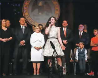  ?? Gabriela Campos/New Mexican file photos ?? Chevel Sheperd of Farmington, the 16-year-old winner of NBC’s “The Voice,” sings “God Bless America” as the closing song for Gov. Michelle Lujan Grisham’s inaugurati­on ceremony last week at the Santa Fe Community Convention Center. “She embodies what I’m talking about when it comes to cultivatin­g young talent,” the governor said several days after the performanc­e. “She has such talent. She’s showing the whole country who we are here in New Mexico.”