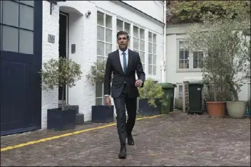  ?? BERESFORD HODGE — PA VIA AP ?? Rishi Sunak, outside his home in London on Friday, was the runner-up to Prime Minister Liz Truss in Conservati­ve Party voting.