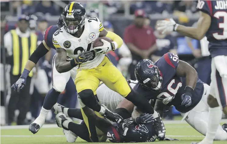  ?? PHOTOS: TIM WARNER/GETTY IMAGES ?? Le’Veon Bell finished with 69 yards and a touchdown as the Pittsburgh Steelers defeated the Houston Texans 34-6 Monday at NRG Stadium in Houston.