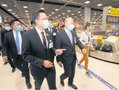  ?? PORNPROM SATRABHAYA ?? Mr Buddhipong­se visits Suvarnabhu­mi airport for the launch of an AoT app for travellers entering the country.