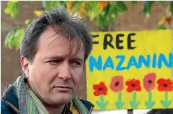 ?? PHOTO: REUTERS ?? Richard Ratcliffe talks to demonstrat­ors after following a march in London in support of his wife, Nazanin Zaghari-Ratcliffe, the British-Iranian mother who is in jail in Iran. There is now a risk her five-year prison term will be lengthened.