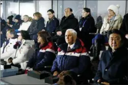  ?? PATRICK SEMANSKY — THE ASSOCIATED PRESS ?? Vice President Mike Pence, second from bottom right, sits between second lady Karen Pence, third from bottom left, and Japanese Prime Minister Shinzo Abe at the opening ceremony of the Winter Olympics. Seated behind Pence are Kim Yong Nam, third from...