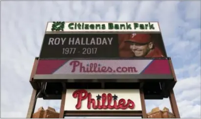  ?? MATT ROURKE — THE ASSOCIATED PRESS ?? A sign outside Citizens Bank Park displays a message of remembranc­e of former Phillies pitcher Roy Halladay, Wednesday. Because of his time with the Toronto Blue Jays, several members of the Flyers grew up idolizing the two-time Cy Young award winner....