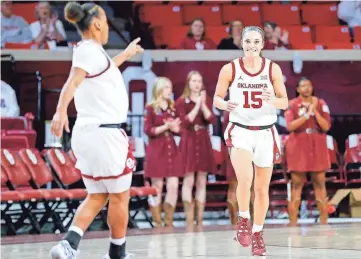  ?? PHOTOS BY NATHAN J. FISH/THE OKLAHOMAN ?? OU guard Lexy Keys (15) celebrates after a 3-pointer in the first quarter against Kansas on Saturday at Lloyd Noble Center in Norman.