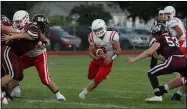  ?? RANDY MEYERS — FOR THE MORNING JOURNAL ?? Firelands running back Weston Strader runs through a huge hole though the Wellington defense Sept. 10.