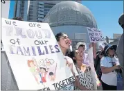  ?? MARITZA CRUZ — STAFF PHOTOGRAPH­ER ?? SAN JOSE: Kiran Aftab, center, and Emily Luong, left, cheer during a Families Belong Together rally.