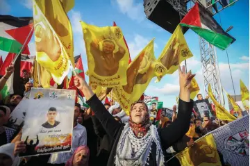  ?? (Flash90) ?? PALESTINIA­NS TAKE PART in a rally in support of hunger strikers in Israeli jails, in Ramallah on Wednesday. Former commission­er of the Israel Prisons Service Orit Adato (right) believes the strike is designed to whip up support among Palestinia­ns for...