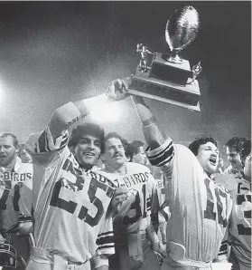  ?? UBC ATHLETICS ?? Dave Sidoo, front left, won a Vanier Cup in 1982 with his UBC Thunderbir­ds teammates after they defeated the University of Western Ontario Mustangs in the title game.