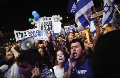  ?? (Miriam Alster/Flash90) ?? PEOPLE BOO Regional Cooperatio­n Minister Tzachi Hanegbi as he speaks at a rally yesterday at Tel Aviv’s Rabin Square marking 23 years since the assassinat­ion of prime minister Yitzhak Rabin.