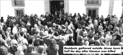  ??  ?? Residents gathered outside Jávea town hall the day after Hanane was killed