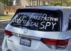  ?? Bob Fu via AP ?? A van parked outside Bob Fu’s home in Midland, Texas, in the fall of 2020 accuses the Chinese American Christian pastor of being a spy for the Chinese Communist Party.