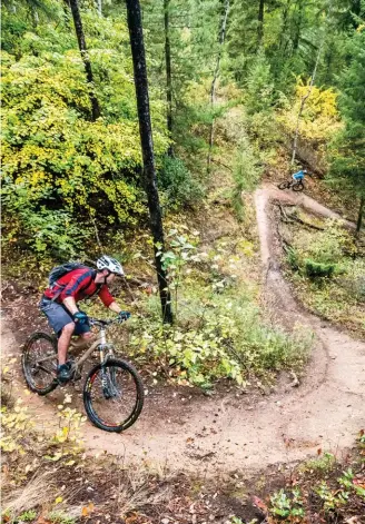  ??  ?? above Bermed corners are always a welcome additon to any trail going downopposi­te There are lots of bridges to ride in Golden, B.C., which helps to keep the trails flowing smoothly