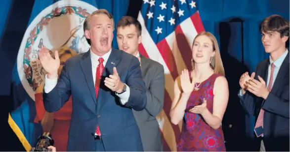  ?? CHIP SOMODEVILL­A/GETTY ?? Republican Glenn Youngkin and his family celebrate his victory late Tuesday in Chantilly, Virginia.