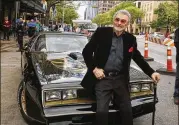  ?? INVISION FILE ?? In this 2016 photo, Burt Reynolds sits on a 1977 Pontiac Trans-Am at the world premiere of “The Bandit” at the Paramount Theatre during the South by Southwest Film Festival in Austin, Texas.