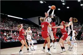  ?? JOSIE LEPE / AP ?? Stanford forward Francesca Belibi (5) shoots against Sacred Heart center Kelsey Wood (34) during the first half of a first-round college basketball game in the women’s NCAA Tournament in Stanford on Friday.