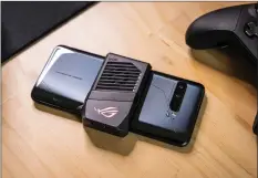  ??  ?? The Asus ROG Phone III has so much power, it comes with a clip-on fan to keep it cool.