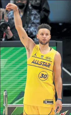  ?? Kevin C. Cox / Getty Images ?? The Warriors’ Steph Curry celebrates after winning the 3-point challenge on Sunday at State Farm Arena in Atlanta.