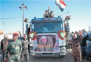  ?? THE ASSOCIATED PRESS ?? Thousands of people gathered Tuesday in Basra, Iraq, to take part in a funeral procession for Abu Mahdi al-Muhandis, a senior Iraqi militia commander who was killed a U.S. airstrike last Friday.