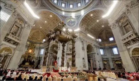  ?? ANDREW MEDICHINI — THE ASSOCIATED PRESS ?? Pope Francis, from beneath the baldachin, celebrates an Epiphany Mass in St. Peter’s Basilica at the Vatican on Saturday. Francis, in a homily to mark Epiphany, said people are “often make do” with having “health, a little money and a bit of...