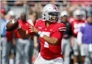  ?? JAY LAPRETE — THE ASSOCIATED PRESS ?? Ohio State quarterbac­k C.J. Stroud drops back to pass against Oregon during the first half of an NCAA college football game Saturday, Sept. 11, 2021, in Columbus, Ohio.