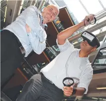  ?? Picture: Contribute­d ?? NEW TECHNOLOGY: Stewart MacDonald (left) and Noeneel Sharma test out Energy Queensland's virtual reality training tool.