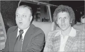  ?? RAY HOWARD/AP PHOTO ?? In this Oct. 10, 1977, file photo, Los Angeles Dodgers manager Tom Lasorda, left, and pitcher Don Sutton ride together on a bus taking them to Yankee Stadium.