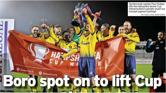  ?? PICTURES: DAVE BODYMORE ?? Farnboroug­h captain Paul Hodges lifts the Hampshire Senior Cup following Boro’s penalty shoot-out triumph against Eastleigh