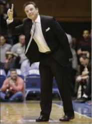  ?? GERRY BROOME — THE ASSOCIATED PRESS ?? Louisville head coach Rick Pitino directs his team against Dukeduring the second half of an NCAA college basketball game in Durham, N.C., Monday. Duke won 72-65.