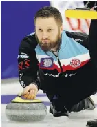  ?? LARRY WONG ?? Skip Charley Thomas delivers a rock against Team Scoffin on Friday in Westlock.