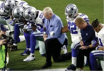  ?? MATT YORK/THE ASSOCIATED PRESS FILE PHOTO ?? Jerry Jones took a knee with Dallas Cowboys players prior to the national anthem at their game on Sept. 25.