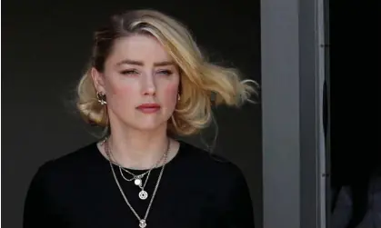  ?? Photograph: Tom Brenner/Reuters ?? Amber Heard leaving court in Fairfax, Virginia, after the jury announced its decision in favour of her former husband Johnny Depp.