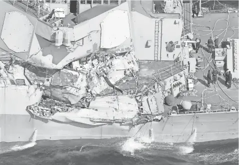  ?? IORI SAGISAWA, AP ?? The USS Fitzgerald’s collision caused significan­t damage above and below the water line on the forward starboard side.