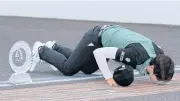  ?? AFP ?? Park Sung-Hyun kisses the finish line of the Indianapol­is Speedway after winning the Indy Women in Tech Championsh­ip.