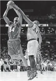  ?? [AP PHOTO] ?? Kwame Brown, left, of the 3 Headed Monsters puts up a shot while Ivan Johnson of the Ghost Ballers defends during a recent BIG3 Basketball League game.