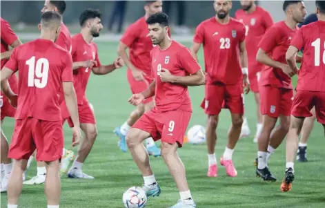  ?? — AFP ?? Iran’s forward Mehdi Taremi attends a training session with his team-mates at Al Rayyan SC in the Al Rayyan district in Doha.