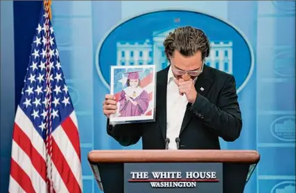  ?? Evan Vucci / Associated Press ?? Actor Matthew Mcconaughe­y holds an image of Alithia Ramirez, 10, who was killed in the mass shooting at an elementary school in Uvalde, Texas, as he speaks during a news briefing at the White House on Tuesday.