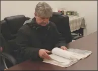  ??  ?? Camden Police Department Criminal Investigat­ion Division Commander Evin Zeek works to familiariz­e himself
with the Crawford case.