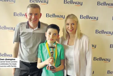  ??  ?? Just champion Jamie Toner (centre) celebrates his triple success with family