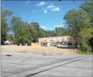  ??  ?? Three town houses are being constructe­d on West Sand Lake Road in North Greenbush on the former site of the popular Villa Valenti Restaurant. The homes are expected to be done in November.