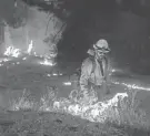  ?? Thursday. NOAH BERGER/AP FILE ?? Firefighters burn vegetation to create a control line along Highway 50 in Eldorado National Forest, Calif., on