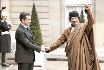  ?? ERIC FEFERBERG/AFP ?? Then-Libyan leader Muammar Gaddafi arrives on December 10, 2007, at the French Elysee Palace in Paris for a meeting with then-French President Nicolas Sarkozy.