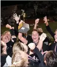  ?? PETE BANNAN - MEDIANEWS GROUP ?? Radnor captain Emily Daiutolo holds up the District 1Class 3A championsh­ip trophy after the Raptors defeated Villa Joseph Marie in the final. They hope to be holding another trophy on Saturday.