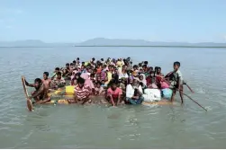 ?? PICTURE: REUTERS ?? DESPERATE: Rohingya refugees cross the Naf River with an improvised raft to reach to Bangladesh at Sabrang near Teknaf, Bangladesh, in November last year.