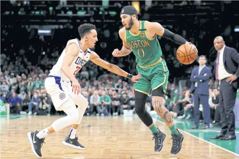  ??  ?? The Clippers’ Landry Shamet defends against the Celtics’ Jayson Tatum during the game at TD Garden in Boston.