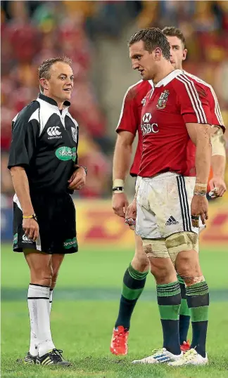  ?? GETTY IMAGES ?? Chris Pollock talks to British and Irish Lions captain Sam Warburton during the first test against the Wallabies in Brisbane in 2013. Pollock still bears the scars from that series.