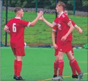  ?? Match report and photograph­s: Derek Black ?? Cammy Clark congratula­tes Thomas McCrindle on his goal.