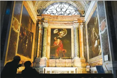  ?? ( AP Photo/ Andrew Medichini) ?? Visitors admire a cycle of paintings by 16th century artist Michelange­lo Merisi, known as Caravaggio, inside the Contarelli chapel of San Luigi dei Francesi Church in Rome.